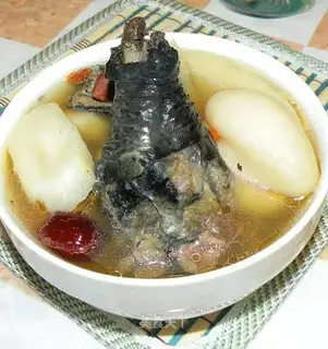 Black chicken stewed with coconut on the sea