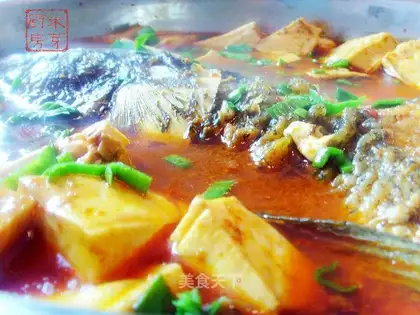 Stewed tofu with fish head with rice sprouts