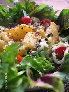 Salad with seasonal vegetables and potato salad