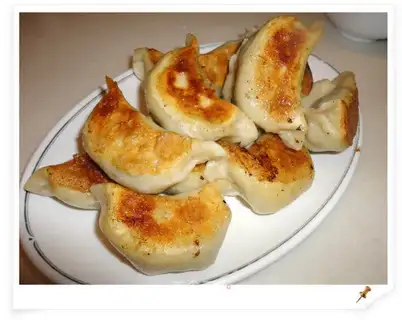 Chinese toon scallop steamed dumplings