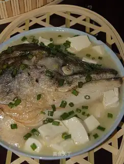 Salmon fish head tofu soup