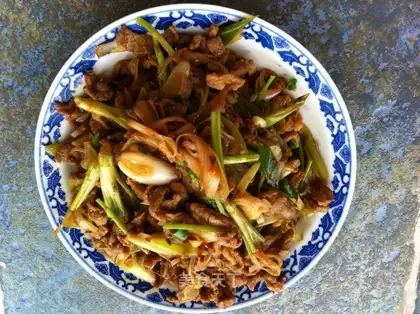 lamb with fried green onions