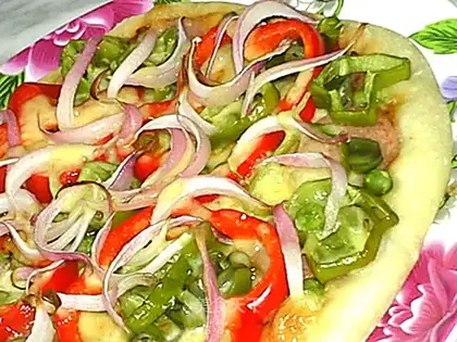 Pizza with ham, bacon and vegetables