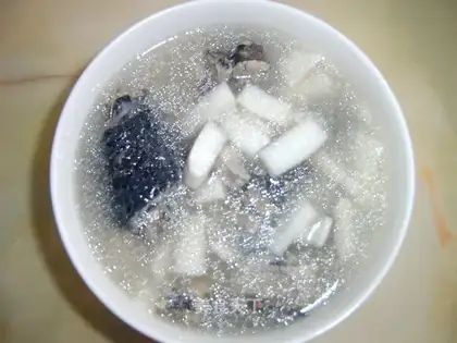 coconut meat and black chicken soup