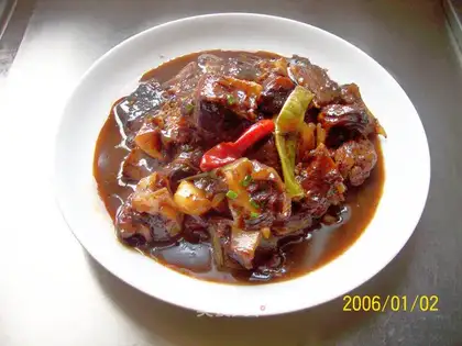 Fresh and spicy ray fish casserole with onions and garlic
