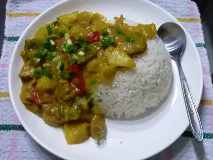 Curried beef poured over rice