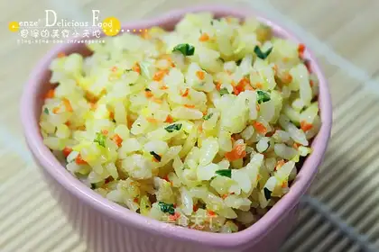 Fried rice with carrot, green vegetables, meat and eggs