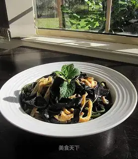 Preserved egg in soup with purple shellfish