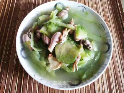 A cold melon with a pickle