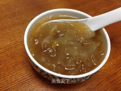 A silver spoon with red dates