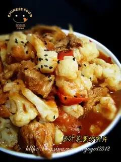 Stir fried pork slices with cauliflower in tomato sauce