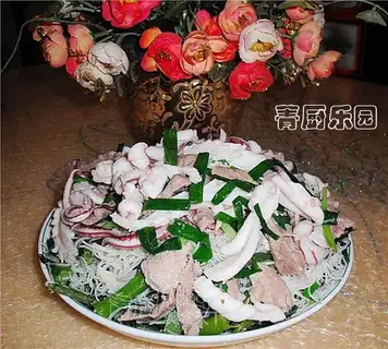 Fried Rice Noodles with Squid and Broccoli