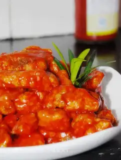 Fish nuggets in tomato sauce