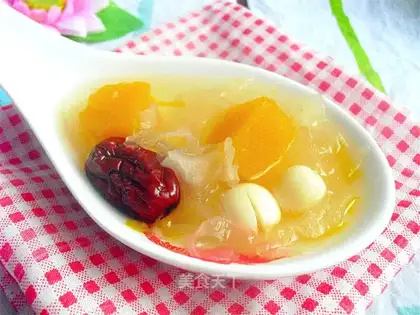 Silver spoon of a pumpkin with red dates