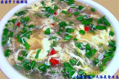 Hot and sour soup with garlic sprouts and radish