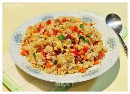 Rice with eggs and vegetables and cured meat