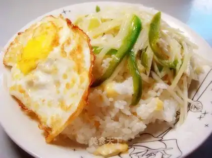 Fried eggs and rice served