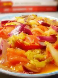 Stewed cabbage with onion and tomato