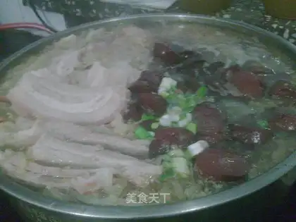 Stewed white meat and blood sausage with pickled cabbage