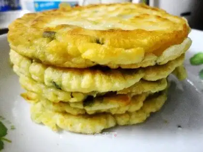 Fried egg cakes in small pan