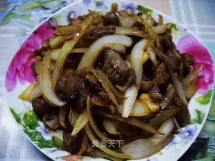 Fried chicken gizzards with onions