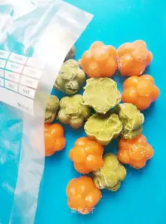 Baby eats carrot mud