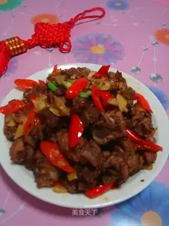 Fried duck pieces with pepper