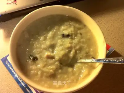 Congee with cabbage, preserved egg and shredded pork