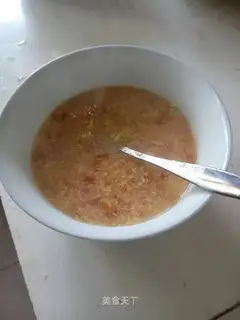 The baby feeds on tomato granular surfaces