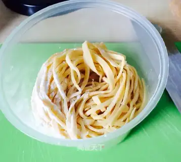 Hands on egg noodles