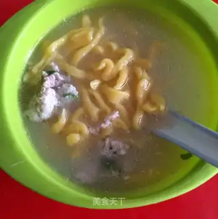 Hand over carrot noodles
