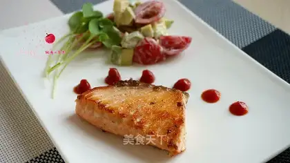 Fried salmon and butter and salad