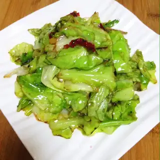 The hand tore the cabbage