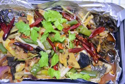 It's common practice to bake fish with beans