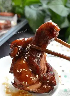 Roast chicken leg with fork
