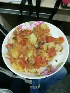 Potato-covered tomatoes