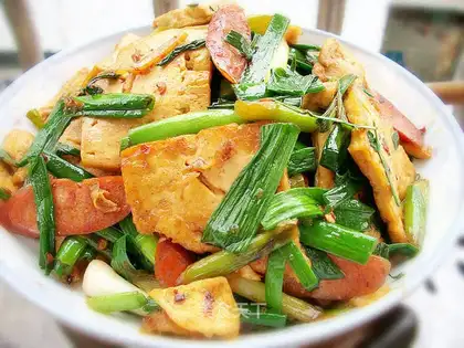 stir-fried tofu with garlic sprouts