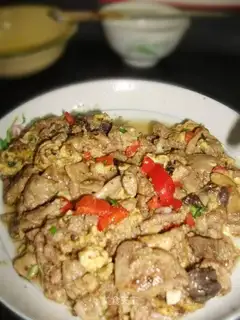 Fried eggs with fish sausage