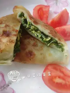 An egg box with a pickle