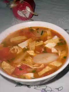 Yam and tomato tofu soup