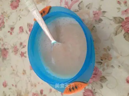 Baby eats banana mud