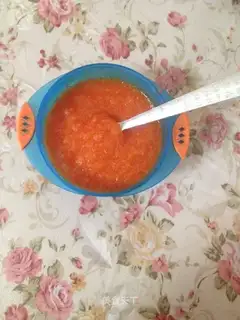 Baby eats carrot mud
