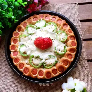 A big shrimp pizza with sausages