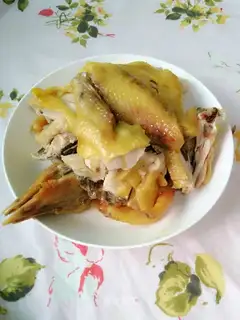 A chicken with a pan