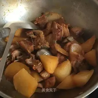 A lamb chop with carrots