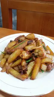 A chicken with fries