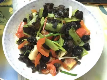 The green pepper is made of black wood