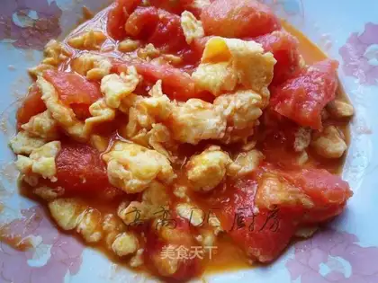 Home-cooked scrambled eggs with tomatoes
