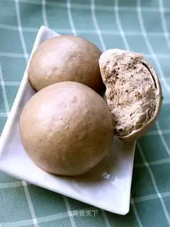 Two black whole wheat buns