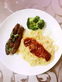 A pork chop with pasta